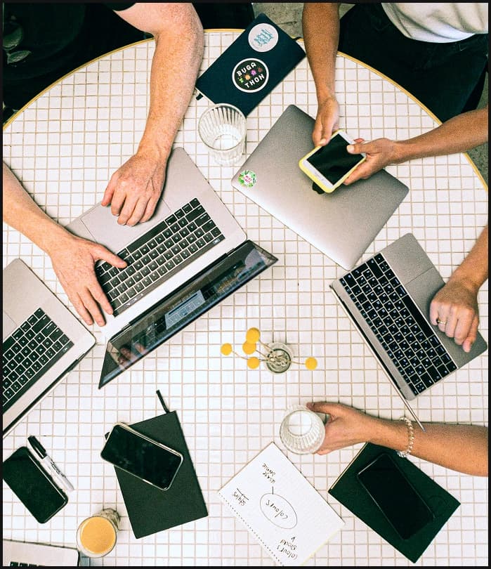 Team members collaborating in a creative workspace